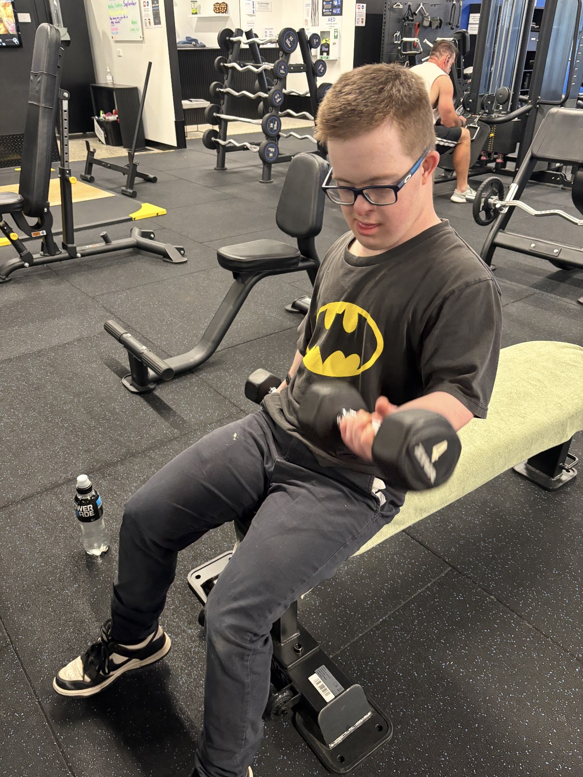 Participant doing a gym workout with support