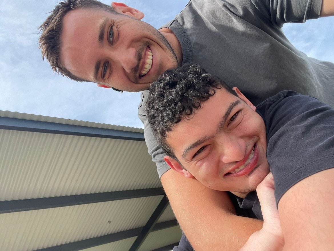 Support worker and participant sharing a laugh together